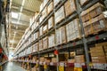 Prague, Czech republic - August 6, 2023: Long shelves with many cardboard boxes with product in warehouse of IKEA