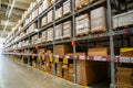 Prague, Czech republic - August 6, 2023: Long shelves with many cardboard boxes with product in warehouse of IKEA