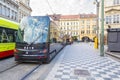 Modern trams on main square of Prague`s Mala Strana next to St. Nicholas Church, Prague Royalty Free Stock Photo