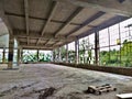 Old abandoned and ruined factory building interior with broken windows, but clean floors Royalty Free Stock Photo
