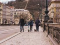 people with dogs on the tourist streets of Prague