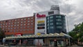 Shopping mall with atypical architectural style in Prague district Vysocany during cloudy weather