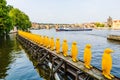 PRAGUE, CZECH REPUBLIC - 24 AUGUST, 2019: Yellow Penguins in row at Kampa park - installation to send message about the dangers of