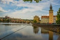 Prague, Czech Republic: Beautiful view of the old town. Panoramic landscape with houses, churches, trees and a river