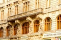 Prague, Czech Republic. 10.05.2019: Close-up view of the facade with windows of old historical buildings in Prague. Retro, old- Royalty Free Stock Photo