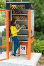 PRAGUE, CZECH REPUBLIC - 20.08.2017: Cute girl with old book in public book booth in Prague