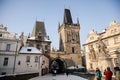 Prague, Czech Republic, 15 December 2022: Lesser Town with Mala Strana bridge towers with spire above River Vltava, View from Royalty Free Stock Photo