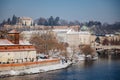 Prague, Czech Republic, 15 December 2022: Lesser Town with towers above River Vltava, View from Charles bridge, snow on roof at Royalty Free Stock Photo