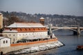 Prague, Czech Republic, 15 December 2022: Lesser Town with towers above River Vltava, View from Charles bridge, snow on roof at Royalty Free Stock Photo