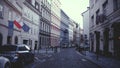 PRAGUE, CZECH REPUBLIC - DECEMBER 3, 2016. Street with Polish, EU flags and parked cars. Old european city view Royalty Free Stock Photo