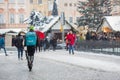 PRAGUE, Czech Republic Ã¢â¬â DECEMBER 12th 2022: Wolt courier on a scooter in snow - Christmas time at old square