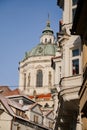 Prague, Czech Republic, 15 December 2022: View of Baroque Church of Saint Nicholas, green dome and bell tower with clock, sunny Royalty Free Stock Photo