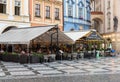 Prague - Czech Republic - Empty cafe terraces during a rainy day at the central market Square in Old Town