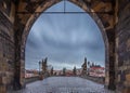 Prague, Czech Republic - Entrance of the world famous Charles Bridge at the Old Town Bridge Tower on a winter morning Royalty Free Stock Photo