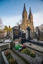 Prague, Czech republic - February 24, 2021. Grave of writer and traveler Miroslav Stingl and Basilica Minor in Vysehrad fortress i