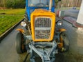 Prague, Czech Republic - January 2, 2018: The colorful tractor is parked near the gas station at Prague, Czech Republic Royalty Free Stock Photo