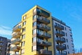 Modern style residential building with corner balconies and yellow facade Royalty Free Stock Photo