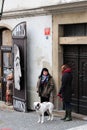 Prague, Czech Republic, January 2015. Scene from the modern life of the old city, a woman and a bulldog.