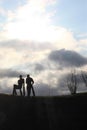 Prague, Czech Republic, January 2015. The setting sun, storm clouds and stone figures of players in the zoo.