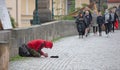 Beggar begging for alms on the street in Prague