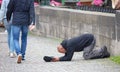 Beggar begging for alms on the street in Prague