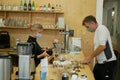PRAGUE, CZECH REPUBLIC, JULY 22, 2020: Coronavirus coffe house restaurant mask face man payment coin banknote waitress