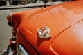 Prague, CZECH REPUBLIC - July 2022. Detail of retro Skoda automobile brand, logo close-up view. 450 orange roadster