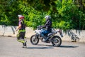 Prague, Czech Republic - July 12, 2022: Male instructor controls L-driver while she doing exercise of driving bike in