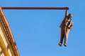 Prague, Czech Republic - July 23, 2019: Man Hanging Out sculpture by the famous czech sculptor David Cerny in the old town of