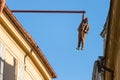 Prague, Czech Republic - July 23, 2019: Man Hanging Out sculpture by the famous czech sculptor David Cerny in the old town of