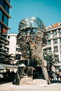 Prague, Czech Republic - July 2022. Moving mirror statue of Franz Kafka by David Cerny. Big metalmorphosis head