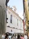 Numerous tourists walk streets and see sights in the old part of the Prague in Czech Republic