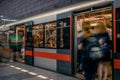 Prague, Czech Republic,23 July 2019; People at metro station entering subway train, long exposure technique for movement. Urban Royalty Free Stock Photo