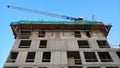 Unfinished high-rise residential building being build seen from bottom up to the sky Royalty Free Stock Photo