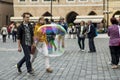 Big soap bubble on the background of people on the central street of Prague