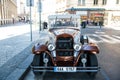 Prague, Czech Republic - June 03, 2017: classic car parked along street side. Vintage sightseeing vehicle. City tour