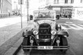 Prague, Czech Republic - June 03, 2017: classic car parked along street side. Vintage sightseeing vehicle. City tour Royalty Free Stock Photo