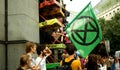 PRAGUE, CZECH REPUBLIC, JUNE 28, 2021: Demonstration Extinction Rebellion protest blocking block blockade Bank, flag Royalty Free Stock Photo