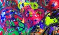 Detail of bright colorful John Lennon`s wall with graffiti in Prague