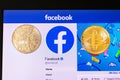 Golden bitcoin lying homepage of Facebook launching digital wallet Calibra and Libra cryptocurrency