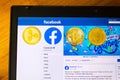 Golden ripple, bitcoin and ethereum coins lying on homepage of Facebook launching digital