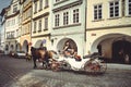 Historical architecture tourists ride horses in carriages. Prague, Czech Republic Royalty Free Stock Photo