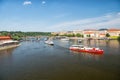 Prague, Czech Republic - June 03, 2017: holiday cruiser ships on cityscape on blue sky. Pleasure boats on Vltava river. Summer vac