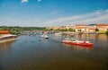 Prague, Czech Republic - June 03, 2017: holiday cruiser ships on cityscape on blue sky. Pleasure boats on Vltava river