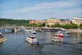 Prague, Czech Republic - June 03, 2017: pleasure boats on Vltava river. Holiday cruiser ships on cityscape on blue sky. Summer vac