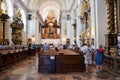 Prague, Czech Republic - June 27 2019: Tourists admiring the Infant Jesus of Prague in the Discalced Carmelite Church of Our Lady