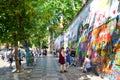 Prague, Czech Republic - June 27 2019: Tourists taking photos in front of famous John Lennon Wall in the center of Czech capital.