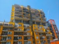 Yellow multistory building in a new developer project in Vysocany