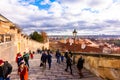 PRAGUE, CZECH REPUBLIC - 8.12.2018: Look from Prague castle stairs to city and houses. Prague cityscape on sunny day. Tourists on Royalty Free Stock Photo