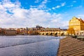 Prague, Czech republic: Look to Charles bridge and Prague castle in far. Sunny winter day near the Vltava river. Panorama view of Royalty Free Stock Photo